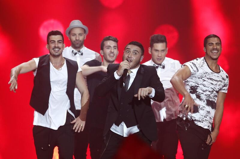 9th place: Israel’s Nadav Guedj, centre, performs during the 60th Eurovision Song Contest final. Dieter Nagl / AFP photo