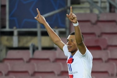 Paris Saint-Germain's French forward Kylian Mbappe celebrates after scoring his team's fourth goal against Barcelona. AFP