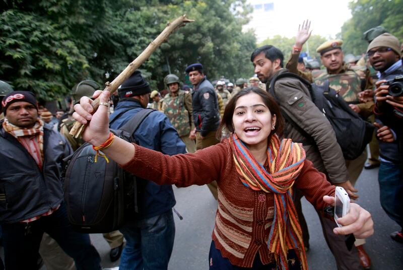 A demonstrator wields a stick during a protest in New Delhi December 30, 2012. The body of a woman whose gang rape provoked protests and rare national debate about violence against women in India arrived back in New Delhi early on Sunday and was quickly cremated at a private ceremony. The unidentified 23-year-old medical student died from her injuries on Saturday, prompting promises of action from a government that has struggled to respond to public outrage. She had suffered brain injuries and massive internal injuries in the attack on December 16, and died in hospital in Singapore where she had been taken for treatment. REUTERS/Danish Siddiqui (INDIA - Tags: CRIME LAW CIVIL UNREST) *** Local Caption ***  DEL28_INDIA-RAPE_1230_11.JPG