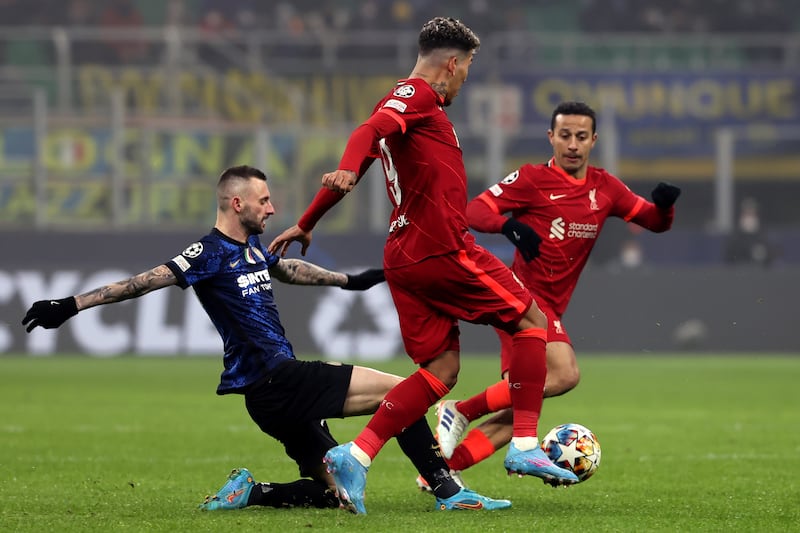 Inter's Marcelo Brozovic challenges Liverpool's Roberto Firmino. AP