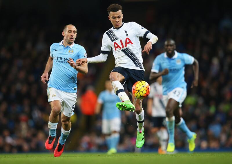 MANCHESTER, ENGLAND - FEBRUARY 14:  Dele Alli of Tottenham Hotspur is closed down by Pablo Zabaleta of Manchester City during the Barclays Premier League match between Manchester City and Tottenham Hotspur at Etihad Stadium on February 14, 2016 in Manchester, England.  (Photo by Alex Livesey/Getty Images)