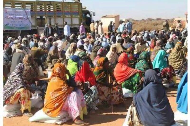 In the village of Salahye, Somalia, hundreds of people await food rations for their families.