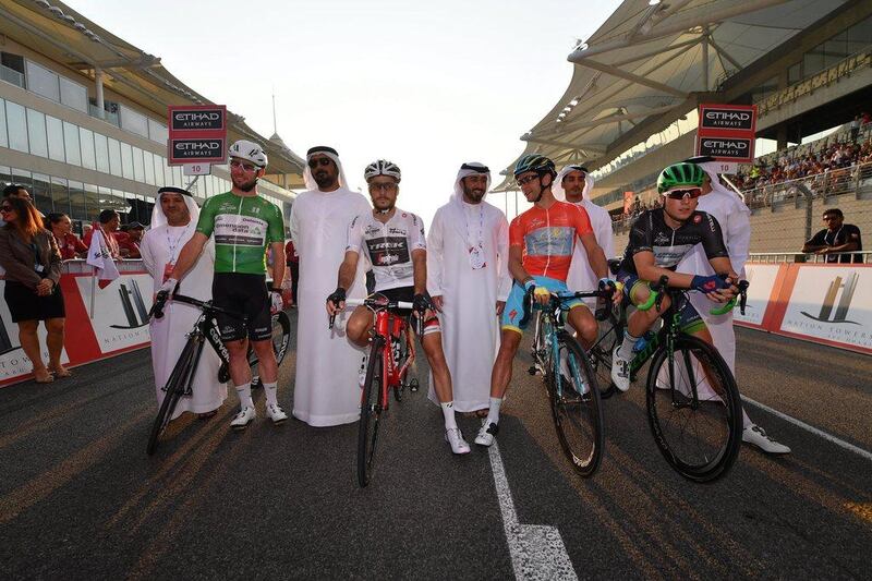 Left to right, Mark Cavendish in the green points jersey, Julien Bernard the white young rider jersey, Tanel Kangert in the red leader’s jersey, Jens Keukeleire in the black intermediate sprint jersey. Luca Zennaro / EPA