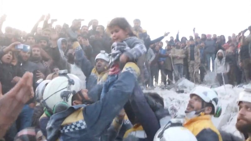 A child being rescued from the rubble in this screengrab obtained from social media, in Bisnia in Syria. Reuters