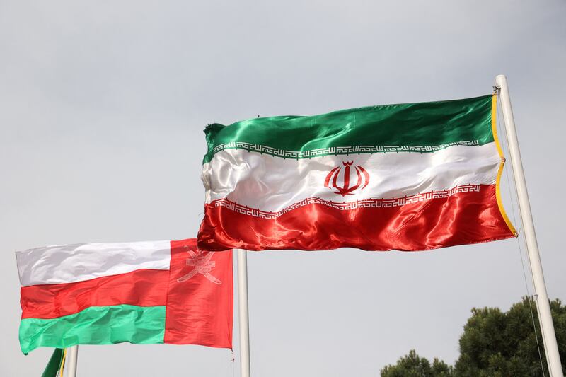 The flags of Iran and Oman. Reuters