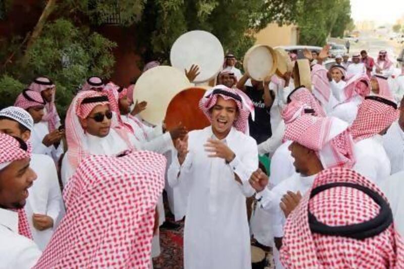 Saudi youths dance as they celebrate Eid Al Fitr in Riyadh.