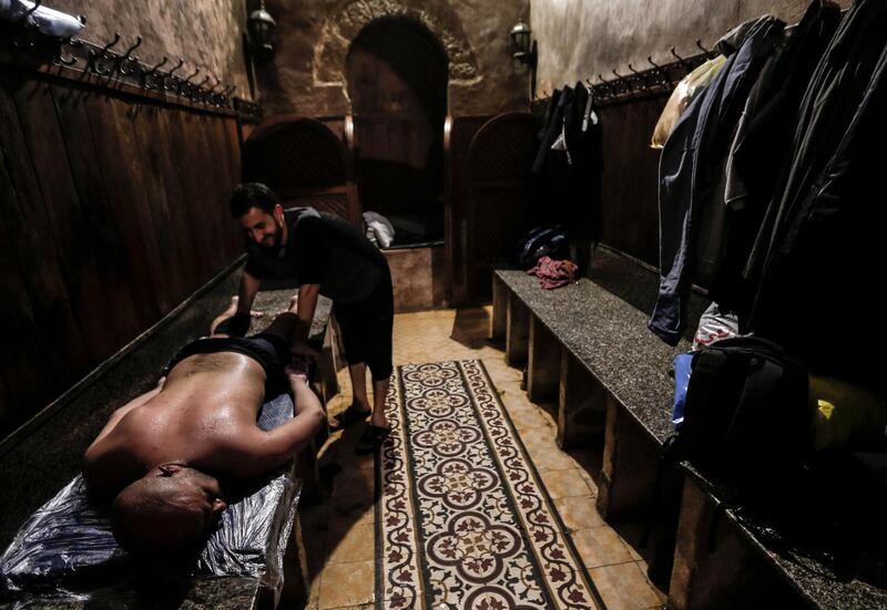 A Palestinian man receives a massage at the Turkish steam bath in Gaza. AFP