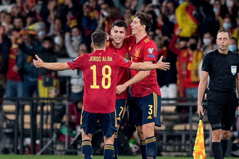 Spain forward Alvaro Morata celebrates with teammates. AFP