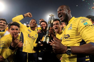 Darren Sammy, right, captained Peshawar Zalmi to the 2017 PSL title, winning the final in Lahore. Faisal Mahmood / Reuters