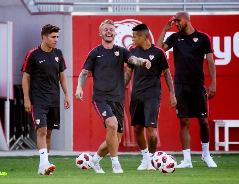 epa06944167 Sevilla's Danish defender Simon Kjaer (C) during a training session in Sevilla, Spain, 11 August 2018. Sevilla will face FC Barcelona in the Spanish Super Cup at Stade Ibn Battouta in Tanger, Morocco, 12 August 2018.  EPA/PEPO HERRERA