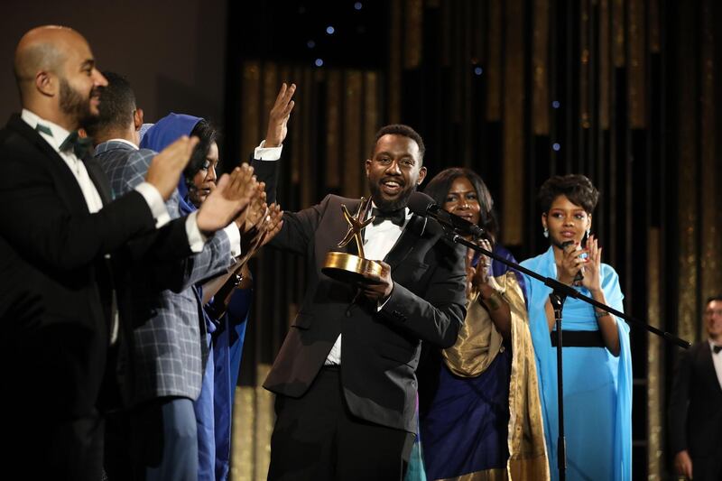 Amjad Abu Alala⁣ accepts the El Gouna Golden Star for Narrative Film. AFP