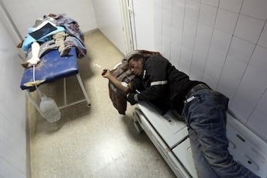 Migrants who were injured in a car crash sleep on beds in a hospital room in Beni Walid, 170 kilometres southeast of the capital Tripoli, on February 14, 2018. AFP