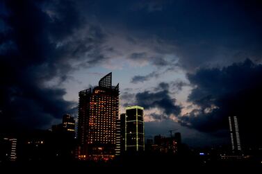 Dark rain clouds pass over buildings in Beirut. EPA