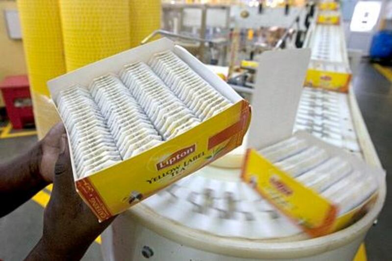 Dubai - JuLY 4, 2011 - Boxes of Lipton tea bags roll along the conveyor line inside the Unilever/Lipton tea factory in the Jebel Ali Free Zone in Dubai, July 4, 2011. The factory produces 1.1 million tea bags per hour, 365 days a year and is the second largest tea producing plant in the world for Unilever. (Photo by Jeff Topping/The National) 

 