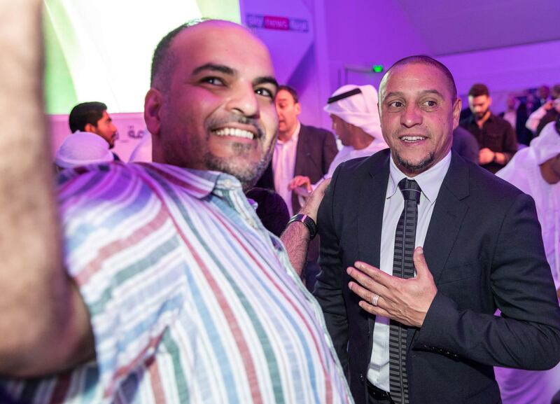 Abu Dhabi, United Arab Emirates, May 22, 2019.    Suhur with Legends at Sky News Arabia HQ. --  A fan takes a selfie with football star, Roberto Carlos at the Suhur.
Victor Besa/The National
Section:   SP
Reporter:  Amith Passela