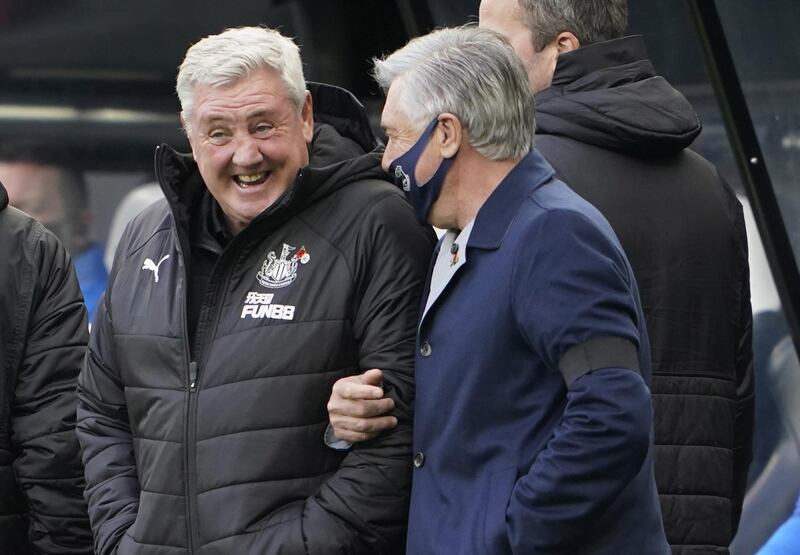 Newcastle manager Steve Bruce, left, and his Everton counterpart Carlo Ancelotti share a joke before the match. EPA