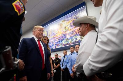 US President Donald Trump and First Lady Melania Trump visit an Emergency Operations Center in El Paso, Texas, August 7, 2019, following last weekend’s mass shootings. / AFP / SAUL LOEB
