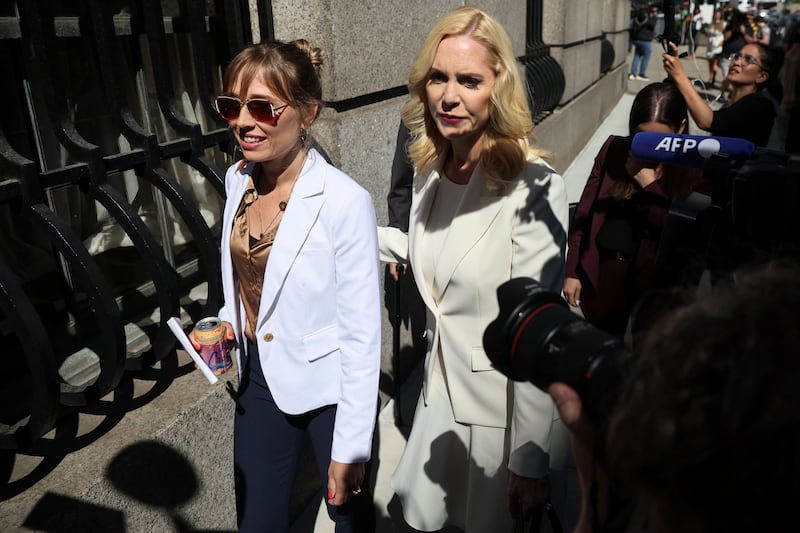Ms Farmer, a victim of Jeffery Epstein, arrives with lawyer Sigrid McCawley for Maxwell's sentencing. Reuters
