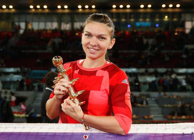 Simona Halep poses with the Madrid Open trophy after defeating Dominika Cibulkova in straight sets. Julian Finney / Getty Images