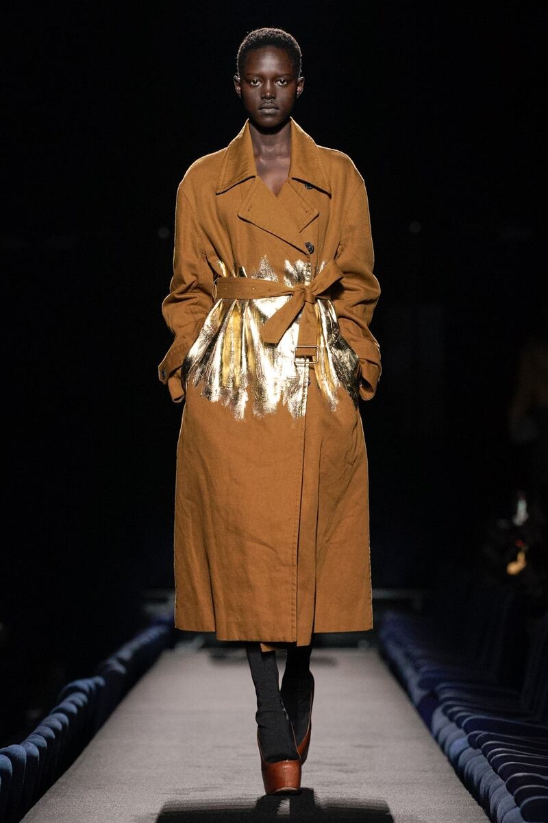 A coat with slashes of hand-painted gold at Dries Van Noten