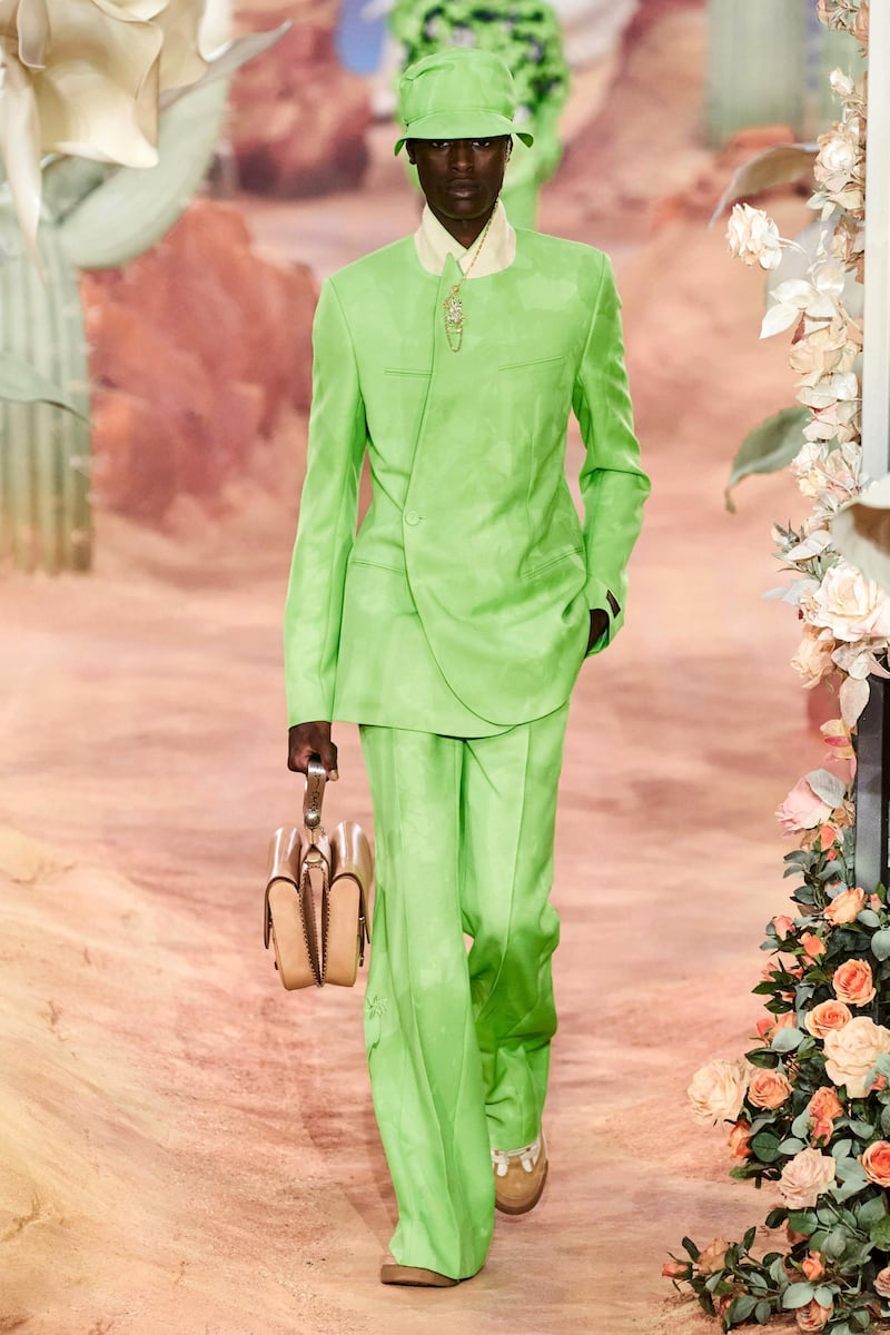 Inspired by the colours of the desert, a suit the colour of new leaves is held closed with jewellery at the neck. Courtesy Dior