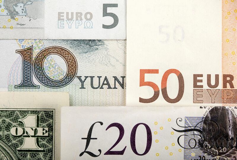 FILE PHOTO: Arrangement of various world currencies including Chinese Yuan, US Dollar, Euro, British Pound, shot January 25, 2011. REUTERS/Kacper Pempel/Illustration/File Photo/File Photo