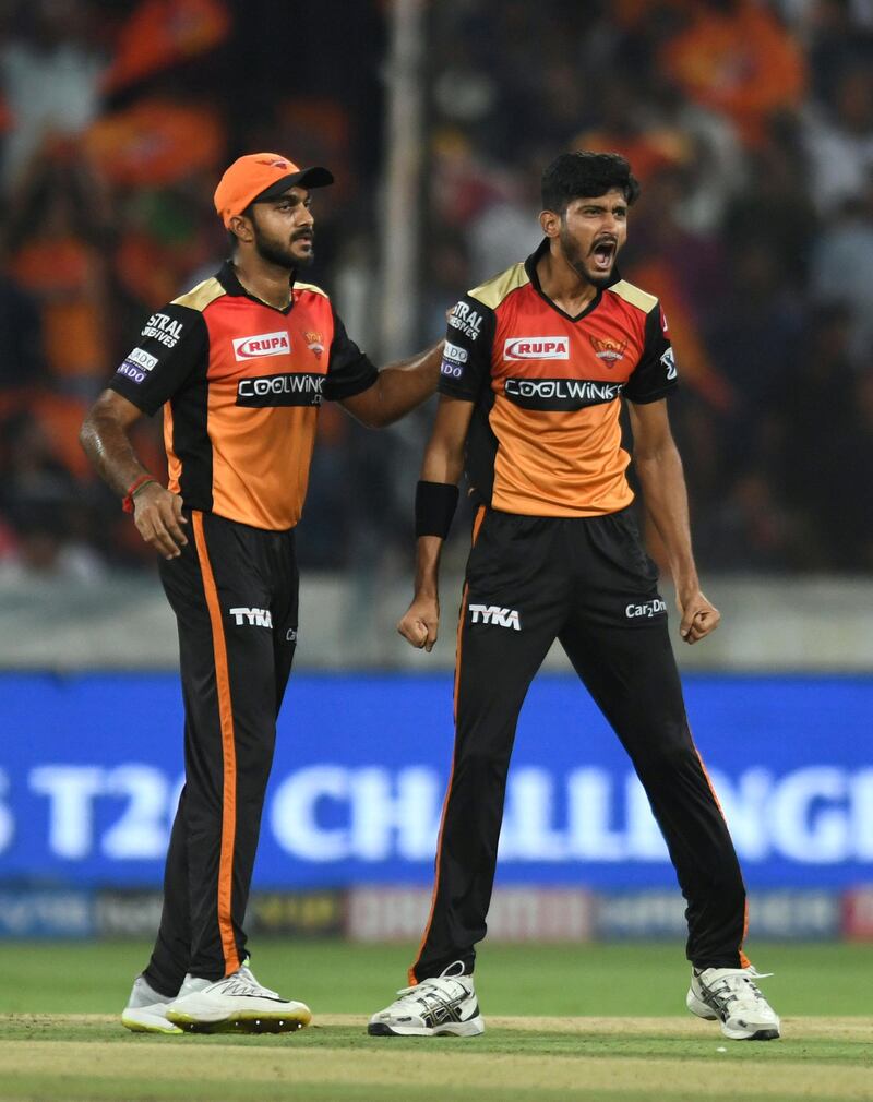 Sunrisers Hyderabad cricketer Khaleel Ahmed (R) celebrates with his teammate Vijay Shankar after taking the wicket of unseen Kings XI Punjab batsman Nicholas Pooran during the 2019 Indian Premier League (IPL) Twenty20 cricket match between Sunrisers Hyderabad and Kings XI Punjab at The Rajiv Gandhi International Cricket Stadium in Hyderabad on April 29, 2019. (Photo by NOAH SEELAM / AFP) / IMAGE RESTRICTED TO EDITORIAL USE - STRICTLY NO COMMERCIAL USE