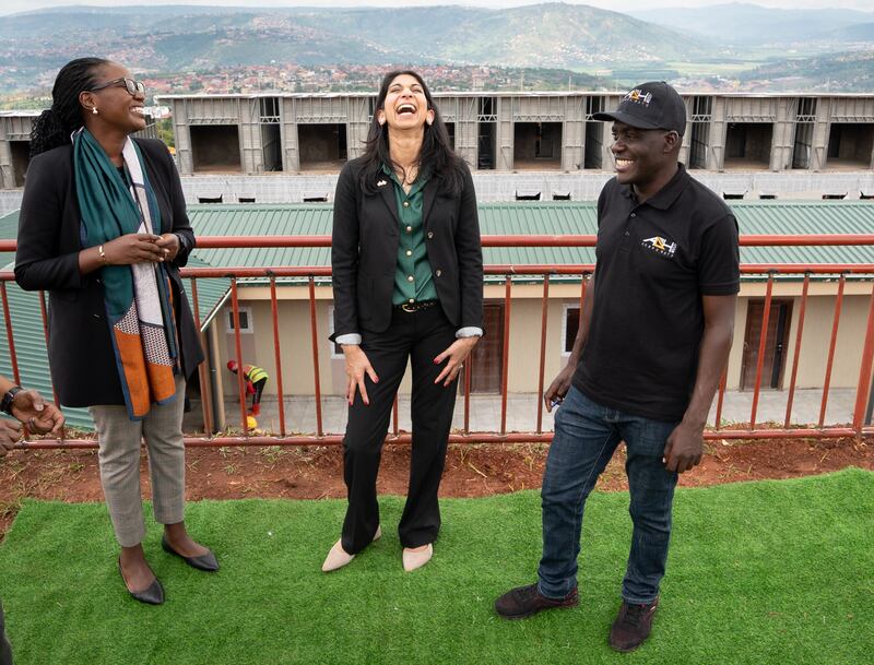 Suella Braverman tours a building site on the outskirts of Kigali during her visit to Rwanda in March to see houses being built that could eventually house deported migrants. PA