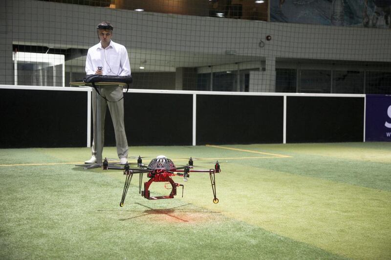 Technical specialist Evgen Chernow operates a drone made by Serhil Horodnii's team Politaimo, who is developing games that allow players to compete against each other using real drones. Lee Hoagland / The National
