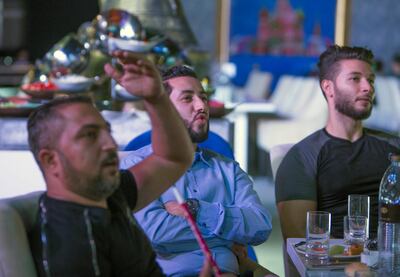 ABU DHABI, UNITED ARAB EMIRATES, 14 June 2018 - Football fans watching the games between Saudi and Russia at Sofitel Corniche tent in Abu Dhabi.  Leslie Pableo for The National story by Anna Zacharias