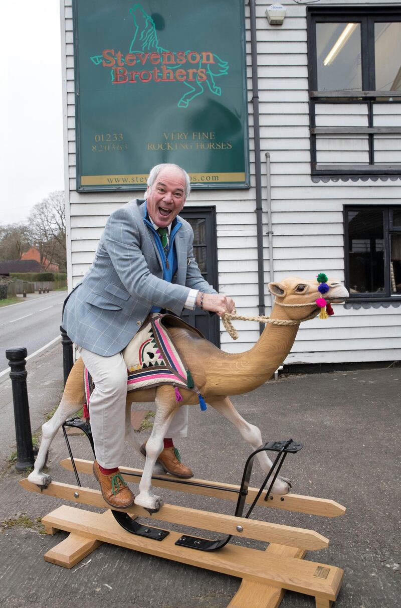 BETHERSDEN,UK 20th March 2019. Marc Stevenson, Co- owner of Stevenson Brothers rocking horse makers  with Humphrey the rocking-camel outside their workshop in the village of Bethersden, near Ashford, United Kingdom. Stephen Lock for the National 
