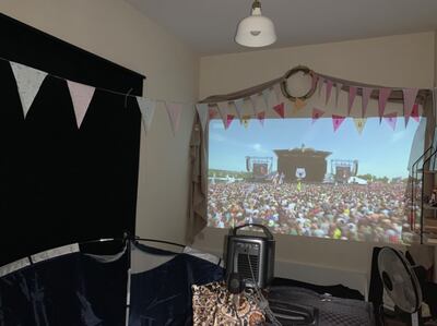 Dubai residents Daniel Evans and Flora Howard have set up a Pyramid Stage in their spare room to mark Glastonbury 2020. Courtesy Daniel Evans 