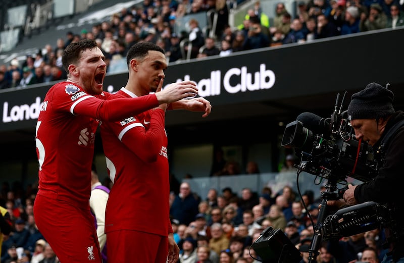 Liverpool's Trent Alexander-Arnold celebrates scoring the opening goal with Andrew Robertson. AFP