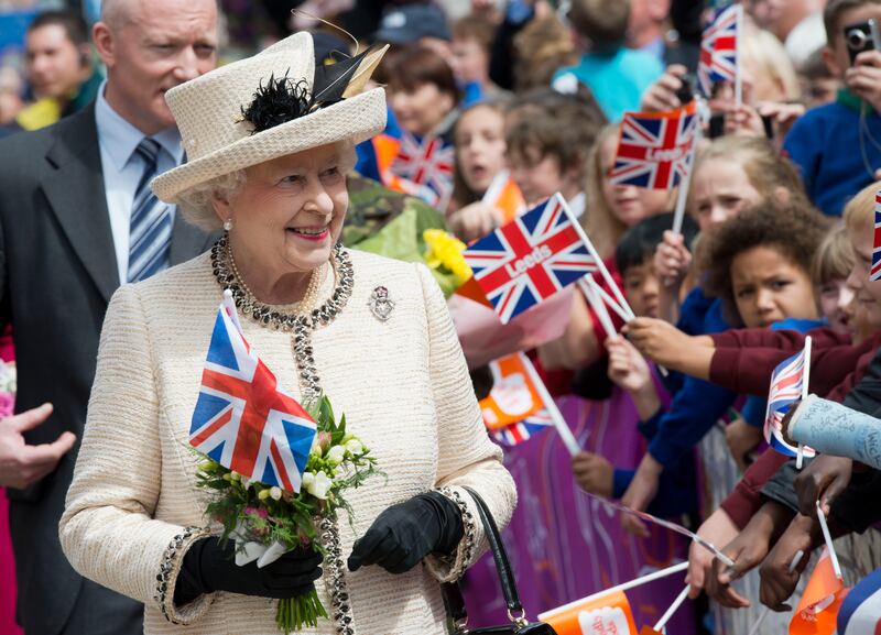 Queen Elizabeth meets members of the public during a visit to Leeds, northern England to celebrate her diamond jubilee in July 2012.