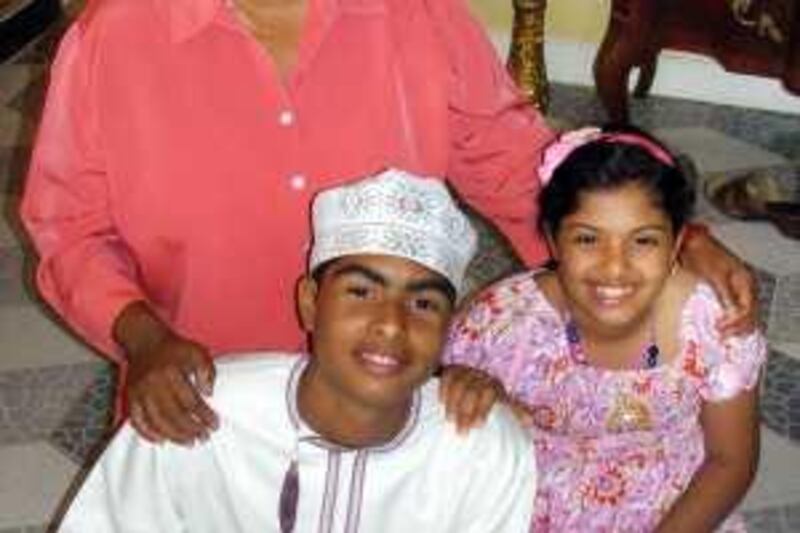 MARCH 28, 2010, OMAN: A foreign housemaid with two Omani children she cares for. Ali Saleh for The National