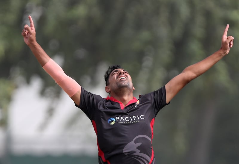 UAE bowler Zahoor Khan celebrates taking the wicket of Namibia's Stephan Baard for 12.
