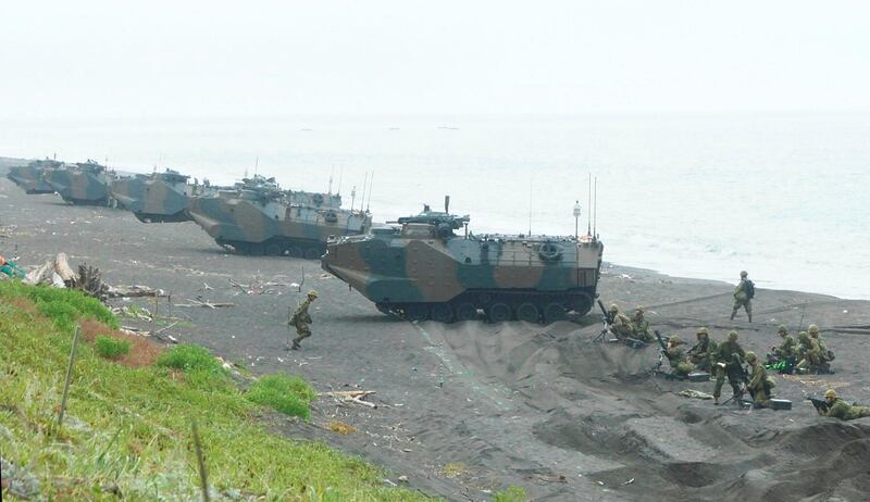 The Assault Amphibious Vehicle Personnel 7(AVV7) of Japanese Ground Self-Defense Forces (JGSDF) land from the sea during the drill in Teshio cho, Hokkaido on Aug. 28, 2020. ( The Yomiuri Shimbun via AP Images )