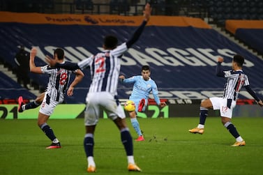 Manchester City's Portuguese defender Joao Cancelo (C) scores his team's second goal during the English Premier League football match between West Bromwich Albion and Manchester City. AFP