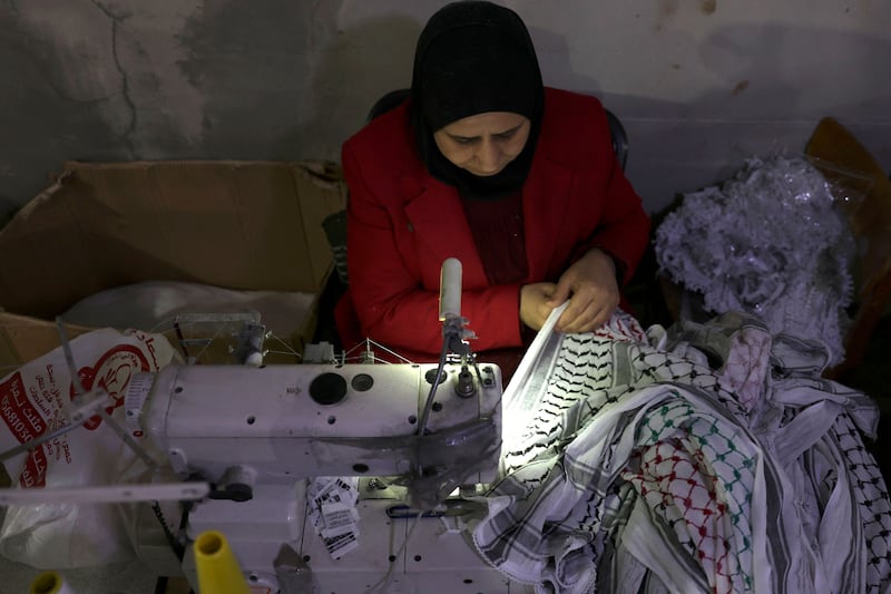 A worker sewing at the Hirbawi keffiyeh factory in Hebron. AFP