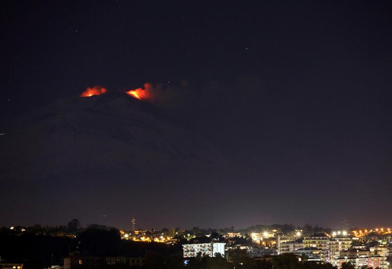 Eruptions from Mount Etna light up the sky during the night, seen from Catania, Italy. Reuters