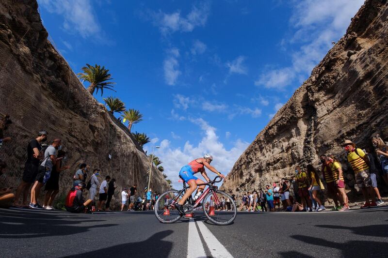 Spectators watch the cycling leg of the Triathlon Challenge race held in Mogan, Gran Canaria on the Canary Island on Saturday, April 24. EPA