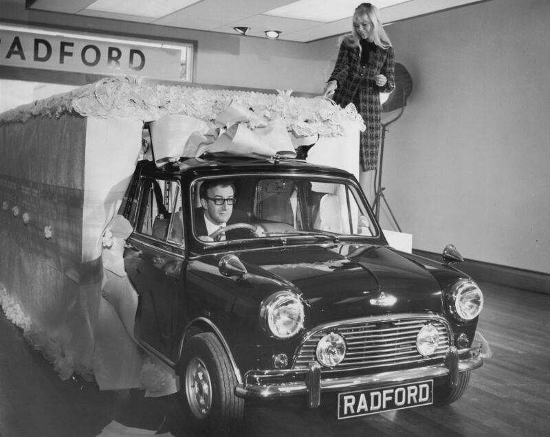 Actor and comedian Peter Sellers drives a luxury mini he had specially made for his wife, Britt Ekland, in 1965. Getty Images