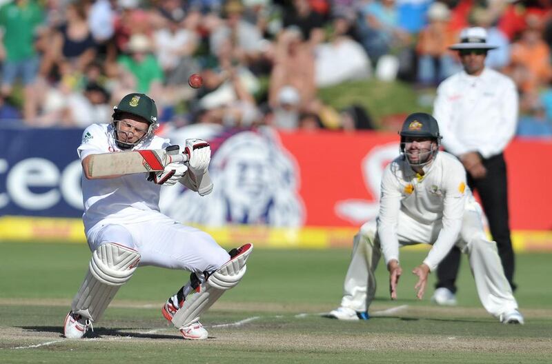 Dale Steyn, left, of South Africa receives a short delivery to the helmet during Day 3 of the third Test against Australia at Newlands on March 3, 2014. Luigi Bennett / AFP