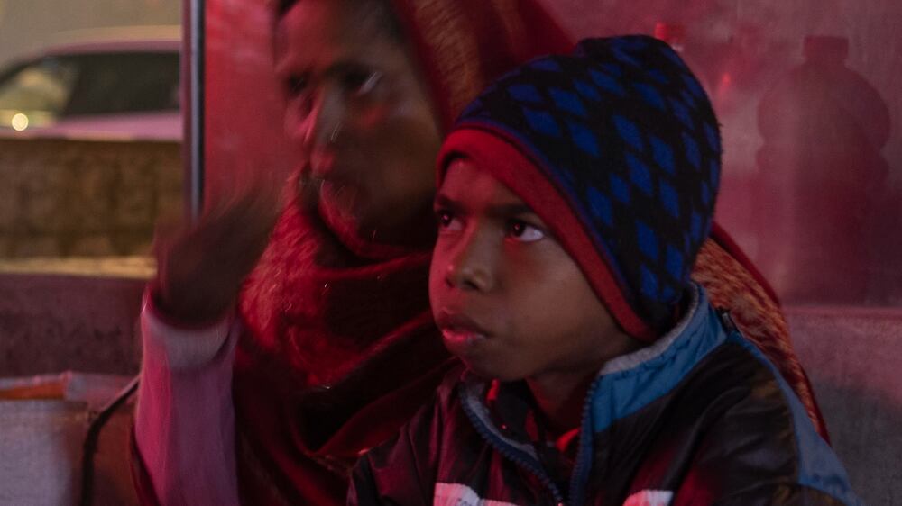 Patients queuing outside India's biggest hospital struggle in cold snap