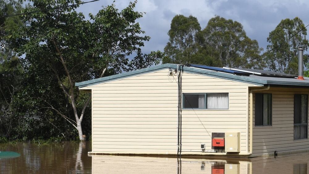 A house is seen surrounded by flood waters from the Mary River in the town of Tiaro, 198 kilometres north of Brisbane, Australia, 09 January 2022.  Areas in Queensland's Wide Bay and Burnett, Fraser Coast and Gympie region have been inundated with rain and flood waters after ex-Cyclone Seth crossed on 08 January morning.   EPA / DARREN ENGLAND  AUSTRALIA AND NEW ZEALAND OUT