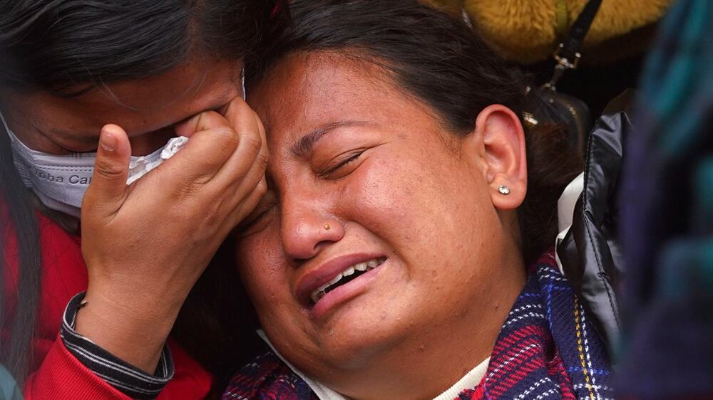 A woman wails as she waits to receive the body of a relative, victim of a plane crash, at a hospital in Pokhara, Nepal, Monday, Jan 16, 2023.  Nepal began a national day of mourning Monday as rescue workers resumed the search for six missing people a day after a plane to a tourist town crashed into a gorge while attempting to land at a newly opened airport, killing at least 66 of the 72 people aboard in the country's deadliest airplane accident in three decades.  (AP Photo / Yunish Gurung)