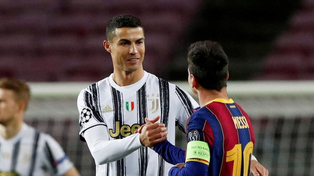 FILE PHOTO: FILE PHOTO: Soccer Football - Champions League - Group G - FC Barcelona v Juventus - Camp Nou, Barcelona, Spain - December 8, 2020 Juventus' Cristiano Ronaldo with FC Barcelona's Lionel Messi before the match REUTERS / Albert Gea / File Photo / File Photo
