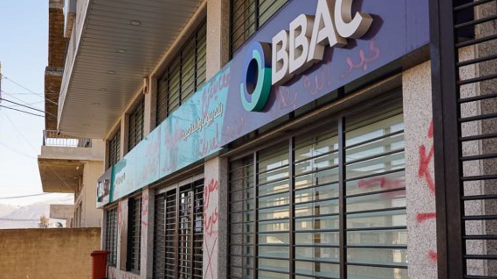 A general view of the Jeb Jennine branch of the BBAC bank where Abdallah Assaii threatened staff in order to withdraw his money. Graffiti on the walls proclaims support for Mr Assaii.