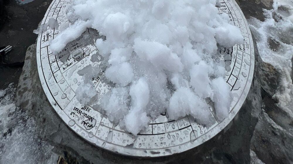 Residents marvel at Oman's snow-covered mountain