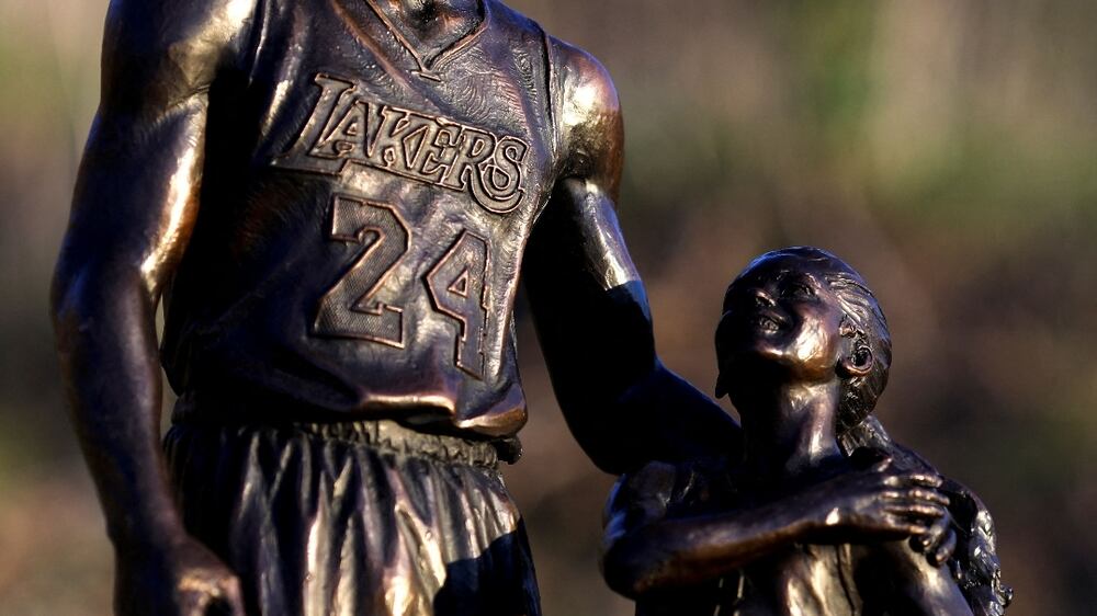 Los Angeles sculptor Dan Medina has honored the anniversary of the deaths of Kobe and Gigi Bryant along with seven other passengers by placing a temporary statue of the two where their helicopter crashed two years ago today in Calabasas, California, U. S. , January 26, 2022.  REUTERS / David Swanson